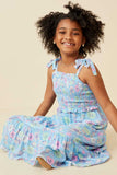 GY6454 Blue Girls Floral Print Ruffled Smocked Tie Strap Dress Pose