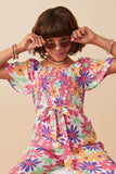 GY8032 Off White Girls Vivid Floral Self Belt Smocked Jumpsuit Pose